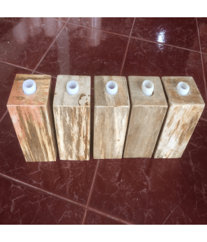 Soap dispenser made of petrified wood with polished surface