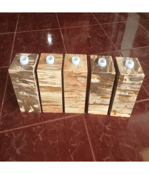 Soap dispenser made of petrified wood with polished surface